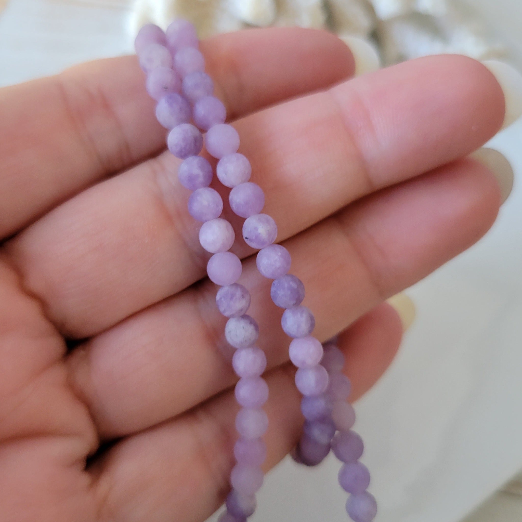 A set of beads and a bracelet on a fishing line with a lock made of natural  stone Amethyst - NB0001